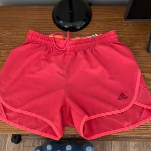 Adidas women’s running shorts. Red with pink outer stripe. Good condition.